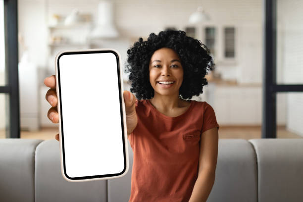 istock Mobile Advertisement. Happy Black Woman Showing Big Blank Smartphone At Camera 1776137500