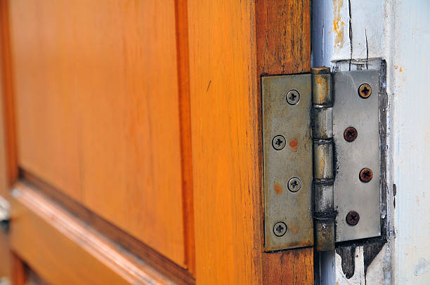 istock hinge on old wooden door 177614454