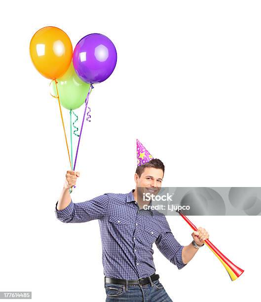 Happy Male Holding Balloons And A Horn Stock Photo - Download Image Now - Adult, Adults Only, Beautiful People