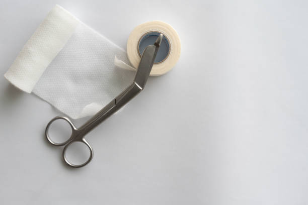 istock Dressing or clean wound tools includes Roll gauze,pile of gauzes and gauze roll cutter or scissors 1776169820