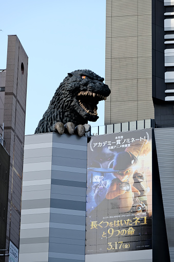 The Godzilla head, a landmark and tourist attraction in Kabukichō, Shinjuku, Tokyo, Japan. The sculpture is on a terrace on the Shinjuku Toho Building. It depicts Godzilla, occasionally with \