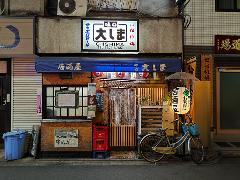 Exterior view of tiny japanese restaurant in Shinjuku district, Tokyo, Japan.