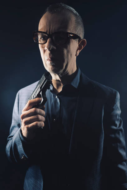 istock Detective spy thriller man with gun photo 1776219820