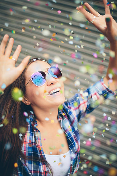 istock Hipster Girl enjoying confetti falling on her 177623152