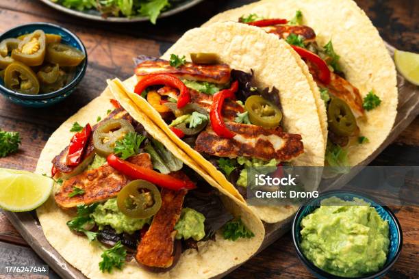 Fried Halloumi Fajitas With Pan Roasted Onions And Bell Peppers Avocado Guacamole And Pickled Jalapeno Peppers Stock Photo - Download Image Now