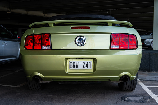 Gothenburg, Sweden - July 22 2023: Rear of a green 2006 Ford Mustang GT.