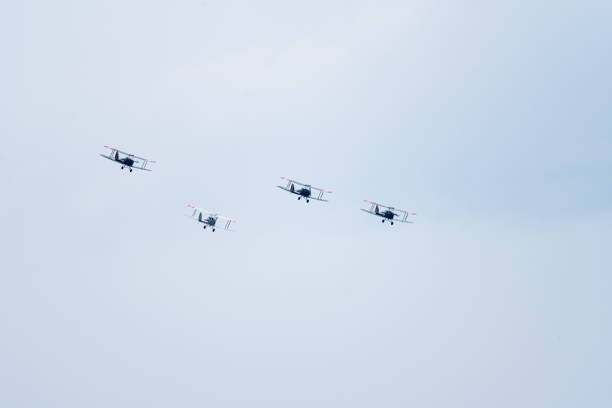 Kjeller, Norway - June 18 2023: Four Norwegian de Havilland DH.82 Tiger Moth performing a display.