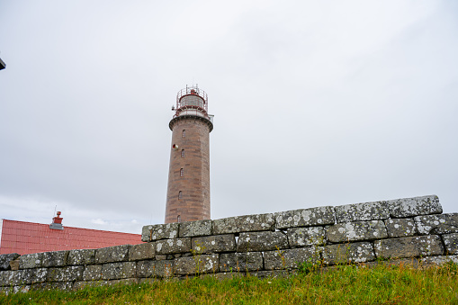 Farsund, Norway - July 02 2023: Looking up on Lista lighthouse.