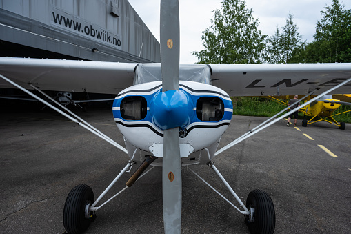 Bishop California, USA, May 13, 2010.  Bishop Airport, (KBIH).  \nWWII American Fighter Aircraft\n\nThe North American P 50D Mustang (Blue) armament, two 100lb. Bombs and six 50 Cal Guns.  Top speed of 362 Mph and  could fly over 2000 miles.  The Curtis P 40E Hellcat (Brown) armament two 100 lb. Bombs and six 50 Cal Guns.  Top speed of 296 Mph and could fly over 1,200 miles.  Both aircraft currently registered in Idaho.  Aircraft were in transit and stopped at Bishop Airport for fuel. \n\nBishop Airport was built in 1928 and expanded and operated by the Army Air Corps during WWII.  During the war it was used as a military flight training base and boasted a chow hall and barracks for pilots during training.  Because of its strategic location east of the 12,000 foot tall Sierra Nevada Mountain range Bishop would be used as a Fall Back Base in the event the Japanese military attacked the California coast.