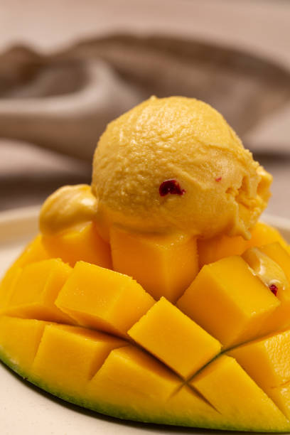 istock Natural mango ice cream on a slice of ripe mango 1776311105