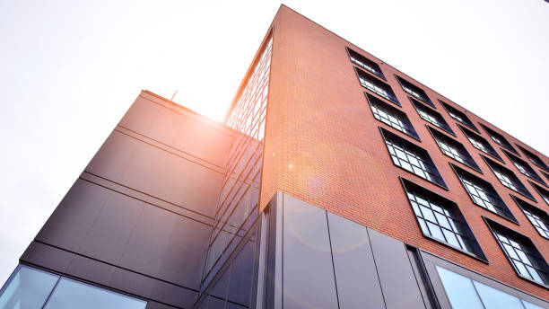 istock A view at a straight facade of a modern building with a dark grey facade. 1776327390