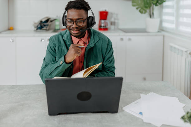 istock Call Center Operator Thrives with Laptop and Headphones in Home-Based Work 1776343234