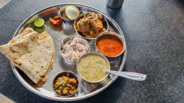 istock Satara chicken thali with pandhra tamda rassa and jwar bhakri 1776346629