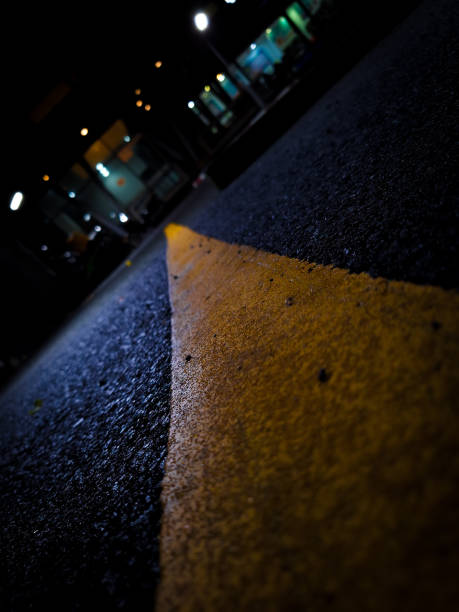 istock dark road, dividing line, yellow, black 1776354990