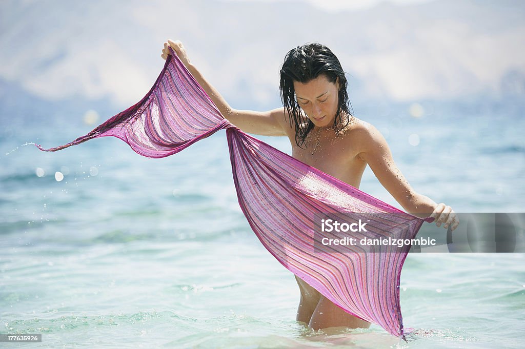 Way of the Wind Beautiful young woman in the sea. Selective focus. 20-24 Years Stock Photo