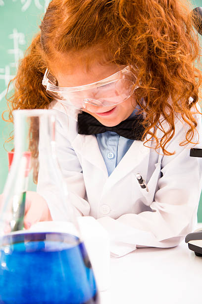 istock Education and Science:  Little red haired girl playing scientist. 177636509