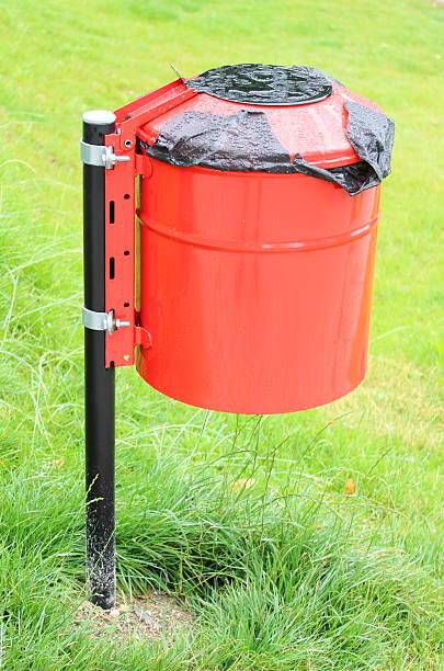 istock Red and wet garbage basket in a park 177638832