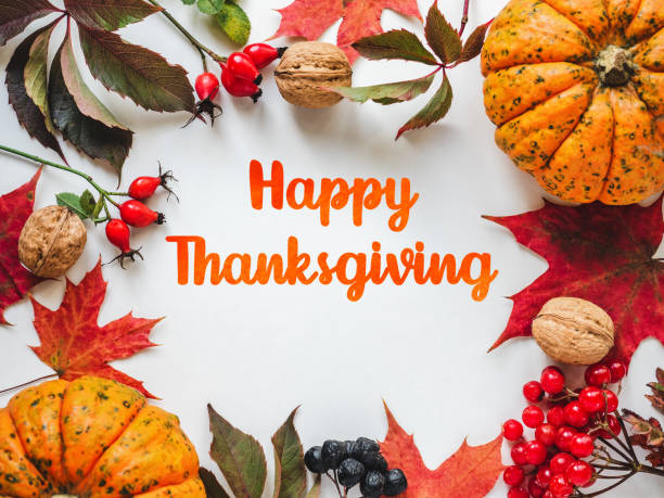 istock Happy Thanksgiving. Bright pumpkins, leaves and red berries 1776419081