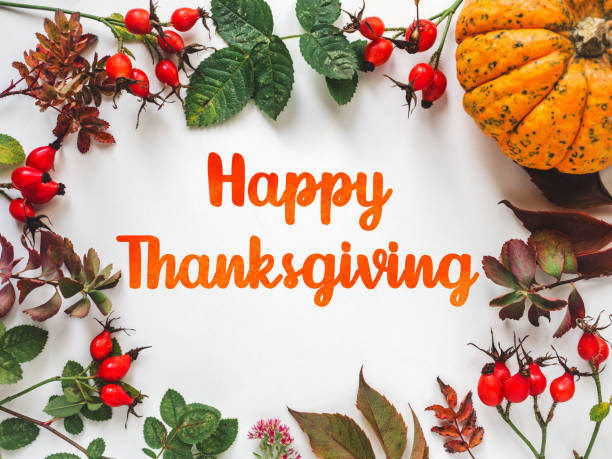 istock Happy Thanksgiving. Bright pumpkins, leaves and red berries 1776419619