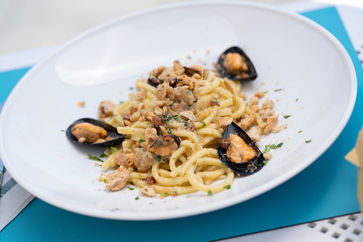 Typical summer dish: spaghetti with mussels and taralli with pepper