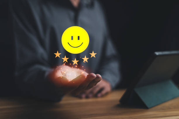 istock Online satisfaction survey evaluation technology. Customer feedback, service provision, business reviews. Man holding virtual smiling face rating with 5 stars. Very happy feedback from the employee 1776420720