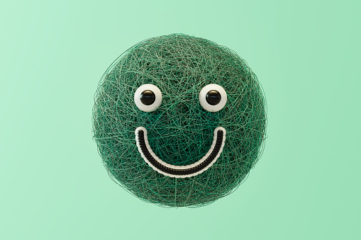 Grassy sphere shaped emoji, grass head. Digitally generated image.