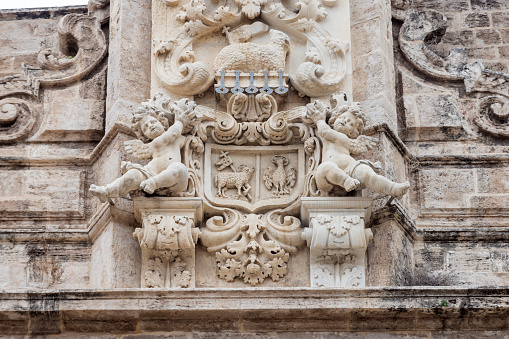 detail of the facade of the Sant Joan del Mercat church, a Roman Catholic church in the market district in the city of Valencia; Valencia, Spain