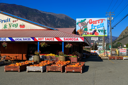 Keremeos, British Columbia, Canada - September 8, 2023: Fruit stand organic farmer's market with display of fresh harvested fruit and vegetables in Keremeos, British Columbia, Canada.