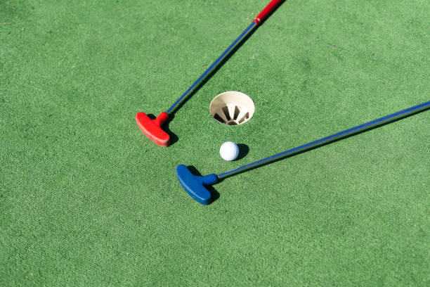 istock colorful golf putters with golf balls on synthetic grass 1776506224