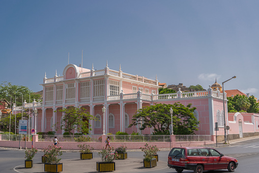 Mindelo, Sao Vicente Island, Cape Verde - October 12.2023: Street scene with the Palacio do Povo - People Palace, at the centre in Mindelo, Cape Verde