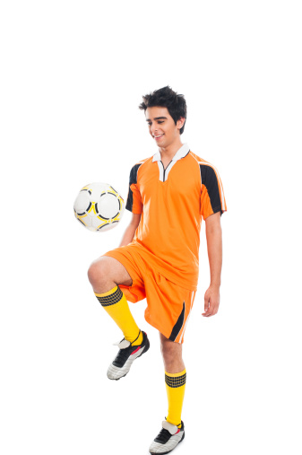 Soccer player practicing with a soccer ball