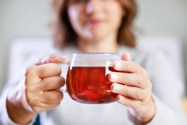 istock Young woman having morning tea 1776522205
