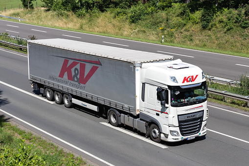 Wiehl, Germany - June 25, 2020: K&V DAF XF truck with curtainside trailer on motorway