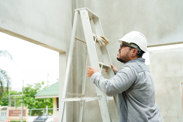 istock Worker, organizer, engineer, Asian male wearing a hard hat to protect from falling debris. climbing stairs To check the neatness of the cement walls and the building and structure of the house. 1776530505