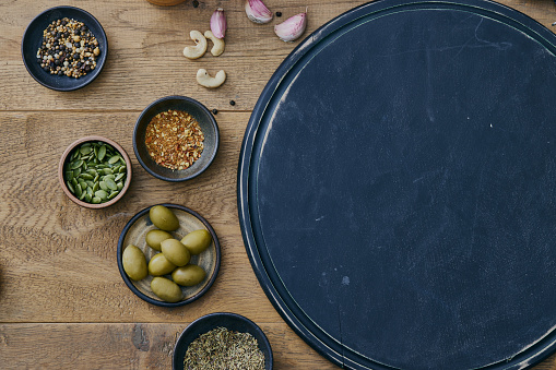 Empty cutting board background for pizza serving, representing Italian food and culture, a healthy living and healthy eating, a wellbeing and indulgence in food, enjoyment in food and street food culture lifestyle