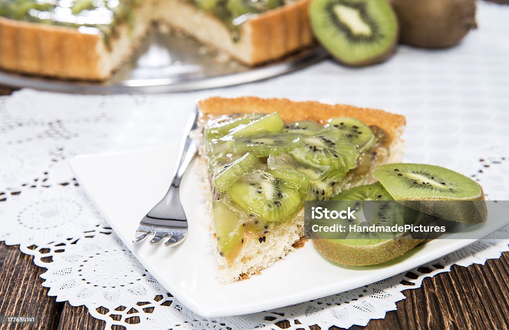 Kiwi Tart on wooden background Kiwi Tart on vintage wooden background Baked Stock Photo