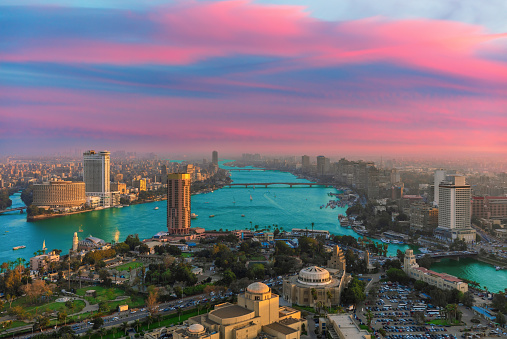 Exclusive aerial sunset panorama of central Cairo, the Nile and the bridges, Egypt.