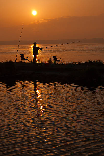 Fisherman sunset stock photo