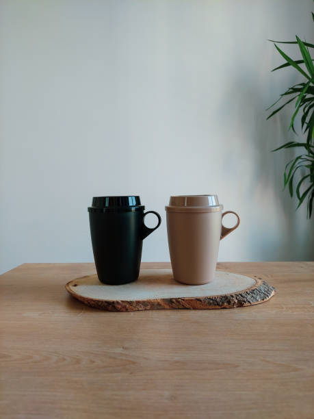 istock White background with plants, reusable coffee cups on wooden background 1776585899