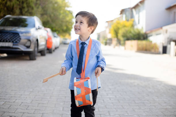 istock boy playing trumpet on the street 1776587014