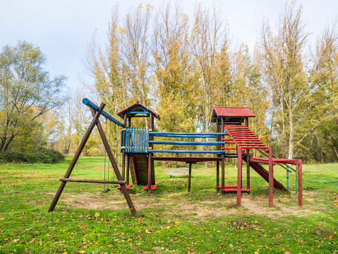 Slide at children's playground in autumn