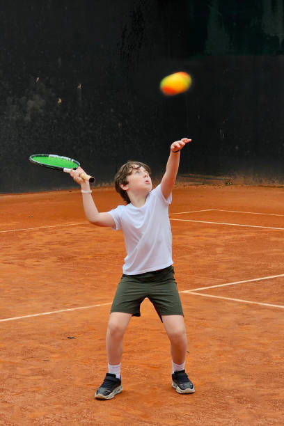 istock 8 year old child playing tennis 1776655509