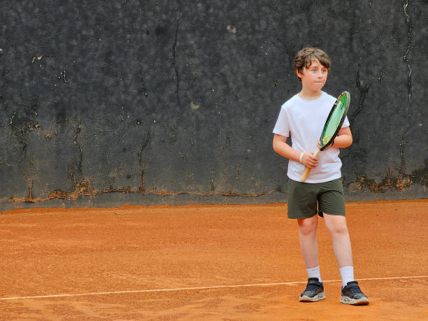 istock 8 year old child playing tennis 1776655531