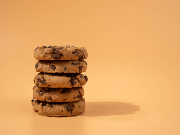 istock Oatmeal cookies with chocolate chips on an orange background. 1776658478