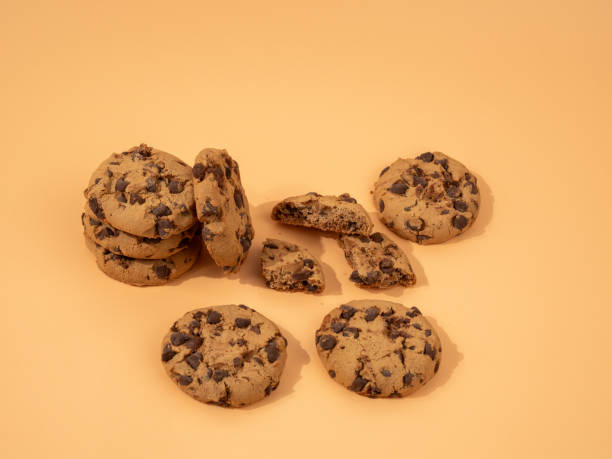 istock Oatmeal cookies with chocolate chips on an orange background. 1776662493