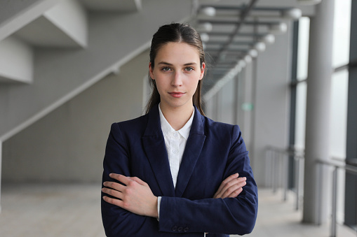 Portrait of a young business woman looking at the camera