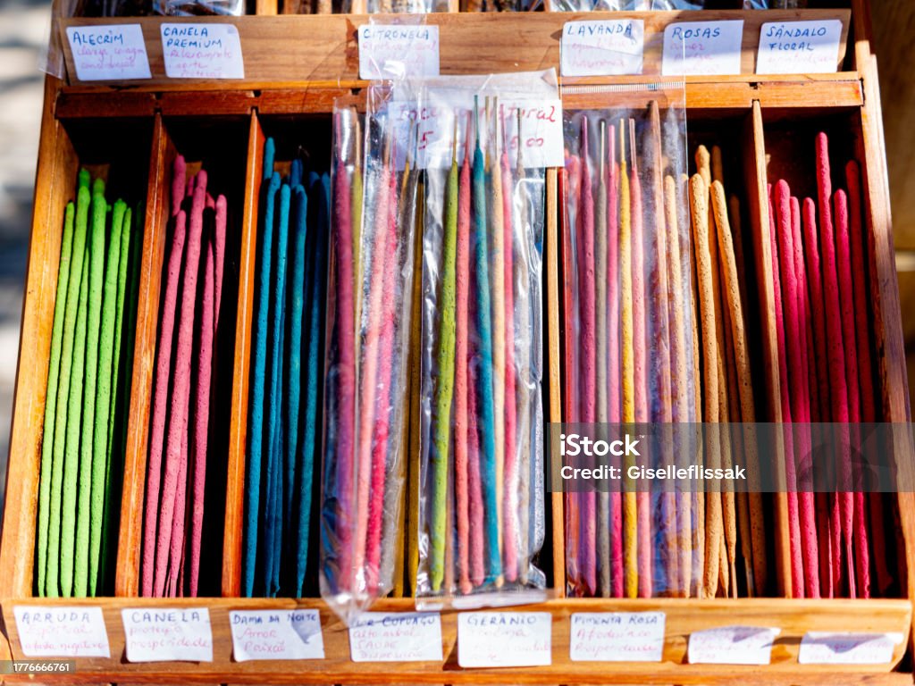 Colorful incense sticks for sell at market stall Colorful display of incense sticks in wooden box for sell at market stall Aromatherapy Stock Photo