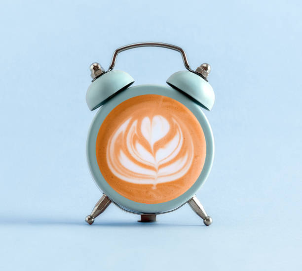 istock Blue alarm clock with coffee into it.  Minimal art coffee collage. 1776690350