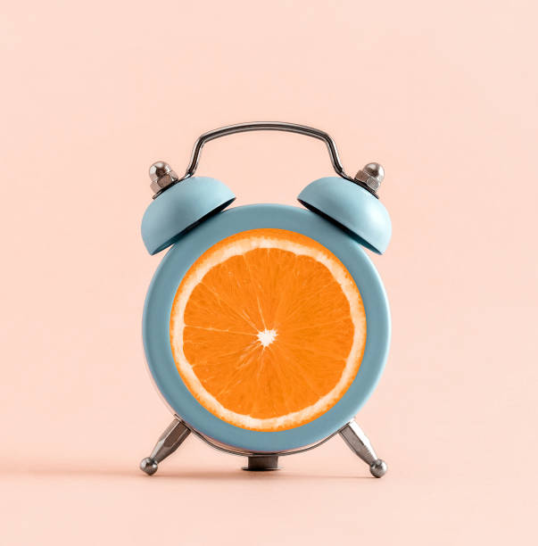 istock Creative art collage alarm clock with orange slice. Bright summer tropical poster concept. 1776690914