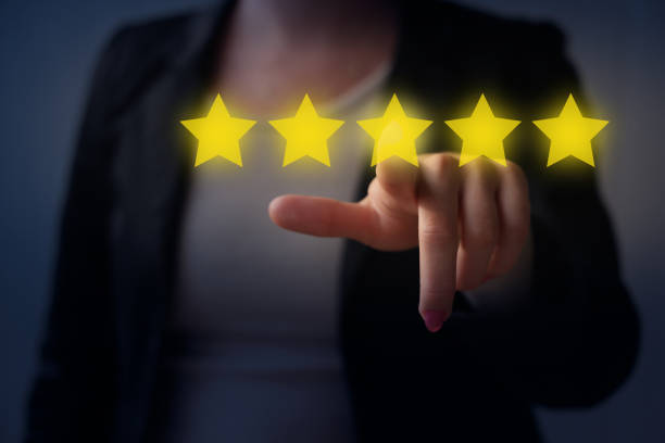 Businesswoman touchscreen gold stars